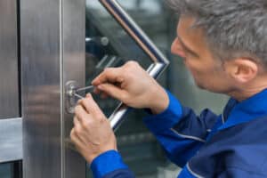 Professional locksmith unlocking door at D and L Locksmith